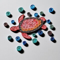 Animal Silhouette Quilling Concept. Colorful turtle design surrounded by swirling patterns.