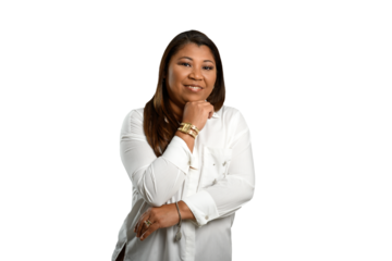 Smiling woman in white shirt posing with hand on chin