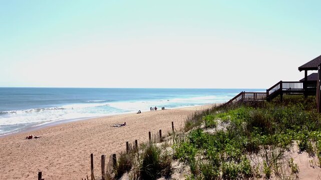 Right to left pan of ocean and beach