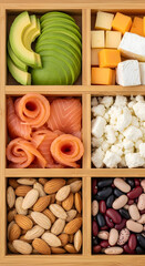 Assorted food ingredients in wooden compartments