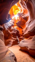Sunlight streams through a sandstone canyon