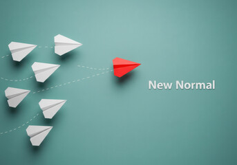 Red paper airplane leads white airplanes towards new normal concept