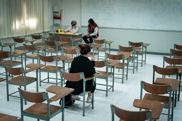 Last Student Completing Final Exam in Classroom