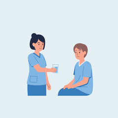A healthcare professional offering a glass of water to a patient in a medical setting.