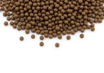 Heap of dry brown dog food pellets on white background