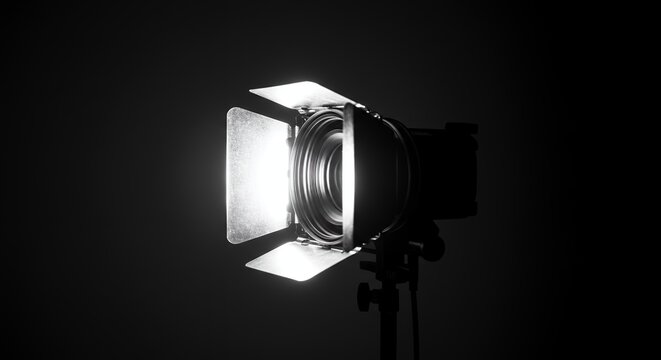 Studio photography spotlight with barn doors on black background professional studio lighting equipment for portrait and product photography