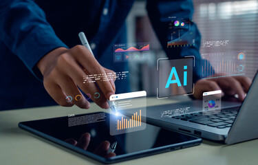 Businessman using tablet and laptop with artificial intelligence, data analytics, and virtual charts. Person analyzing digital information, AI technology, and smart solutions for business strategy.