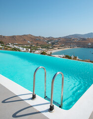 Infinity pool with caldera view in Mykonos luxury hotel
