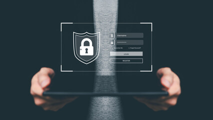 Businessman holding tablet with holographic login interface and padlock shield icon, symbolizing cybersecurity, data protection, privacy, secure access and digital authentication.