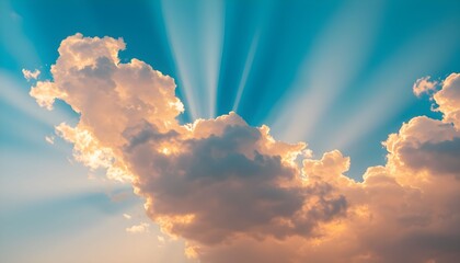 Golden sun rays burst through fluffy, warm-toned clouds against a vibrant blue sky, creating a hopeful and majestic scene.