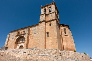 The historic Gothic Church of the Assumption, with a 17th-century Renaissance portal, in Olmedillo de Roa, Spain.a