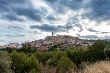 Fototapeta premium Scenic view of the historic town of Peñarroya de Tastavins, dominated by its 18th-century Baroque church, Spain.