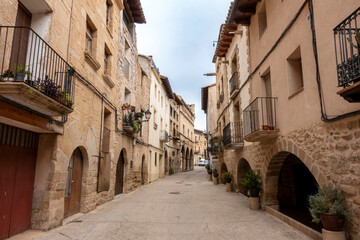 The historic Calle Mayor (main street), with 16th-18th century architecture, in the old town of La Fresneda, Spain.