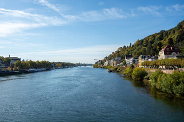 Fototapeta premium Scenic river view with greenery and buildings