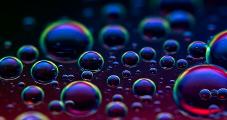 Colorful bubbles on a dark background reflecting light - Powered by Adobe