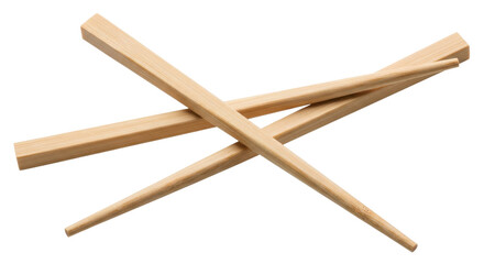 Isolated wooden chopsticks lying crossed on a surface, natural light reflecting from the wood