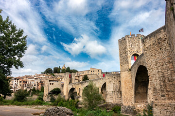Historic Romanesque Besalú Bridge Gerona Spain 12th Century Medieval Fortress Bridge and Tower Against Blue Sky