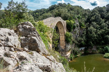 Historic Romanesque Pont de Llierca Bridge Gerona Spain 14th Century Medieval Stone Arch Over River and Rocky Gorge