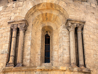 Fototapeta premium Detail of a 12th-century Romanesque apse window at the Church of San Cristóbal in Beget, Spain.