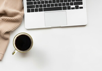 Minimalist Soft Autumn Feminine White Desk Flatlay with blank negative space - laptop and coffee with scarf