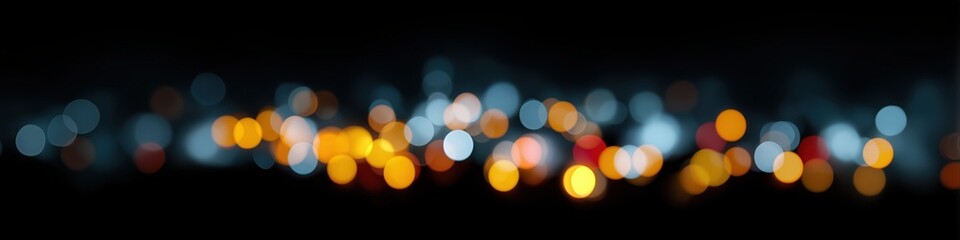 Abstract bokeh lights in varying colors against a dark background