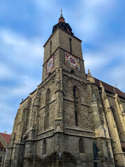 Gothic church with clock tower in Brasov, Romania