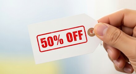 Huge sale event promotional offer discount tag in hand for retail shopping and seasonal clearance savings