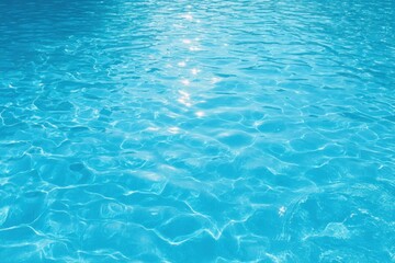 Obraz premium A vibrant, light-blue pool surface, reflecting sunlight in a pattern of ripples and sparkles.