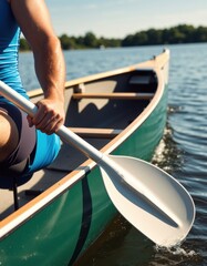 Obraz premium Person paddling a canoe on calm lake during sunny day