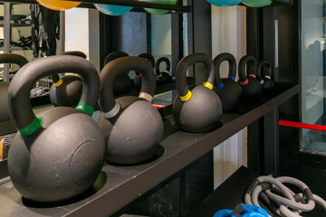 Row of kettlebells in fitness gym