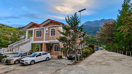 Scenic mountain village landscape with traditional homestay in Kundasang, Sabah.