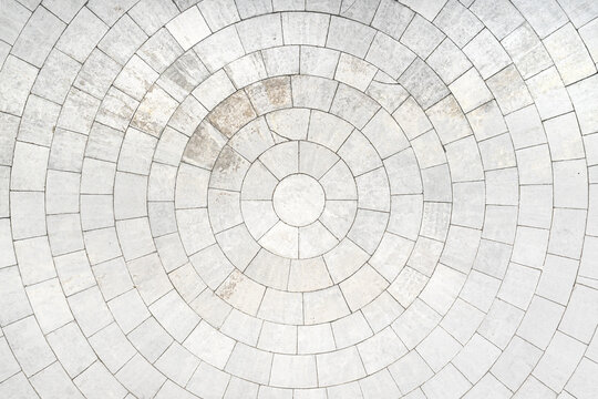 concentric stone tile block circles create an intriguing neutral white off-white photography abstract background