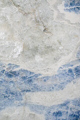 Blue and White marbled crystal texture abstract background; Icy blue and white crystals of a geology specimen cross section