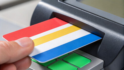 Omnichannel retail enhances customer experience. A hand inserting a colorful card into an ATM machine for transaction purposes.