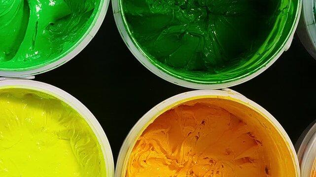 top view of Industrial Plastisol Ink for Fabric Printing
Plastisol ink is an essential raw material in the Tee shirt printing industry stored in barrels and containers across factories and stores.