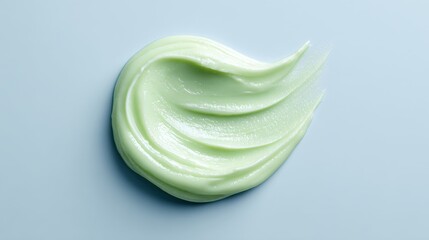 Soft green cream on a light surface