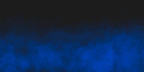 Abstract blue smoke moves on black background.Beautiful swirling blue smoke. Wide angle horizontal wallpaper or web banner.