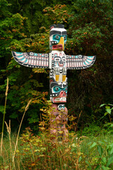 Autumn Leaves Stanley Park Totem. Stanley Park totem pole with autumn leaves, Vancouver, British Columbia, Canada.
