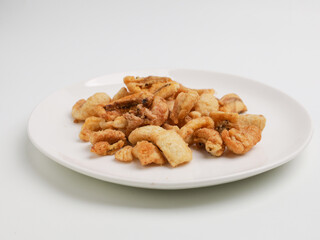 Crunchy banana chips on white background