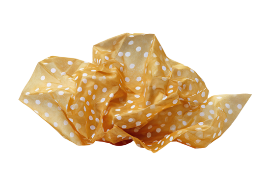 Crumpled metallic gold tissue paper with white polka micro-print isolated on transparent background.