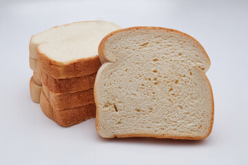 Five slices of Jamaican hard dough bread isolated on white background