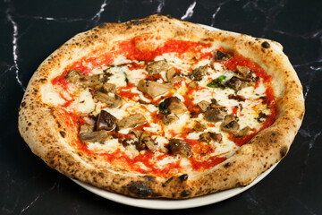 Neapolitan pizza with porcini mushrooms and mozzarella