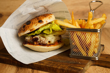 Beef burger with grilled onions and fries