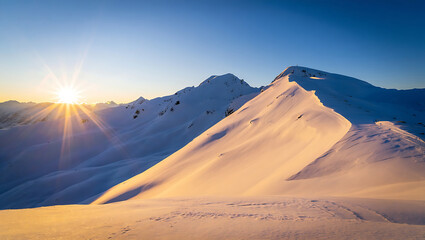 Snowy mountain ridges in winter sunlight

