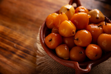 Tejocote en almibar. Typical Mexican dessert made with Tejocote (Crataegus mexicana), a Mexican fruit in syrup, a fruit widely used in autumn, the Day of the Dead, posadas and the Christmas season.