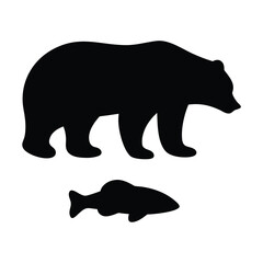 Silhouette of a bear standing above a fish representing nature and wildlife