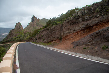 Winding Mountain Road Through Volcanic Landscape Under Overcast Sky