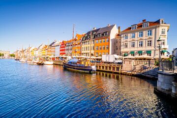 Boat canal in Copenhagen in the morning. Nyhavn, famous tourist destination with colorful buildings...