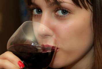 Young Woman Drinking Red Wine