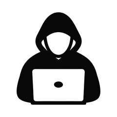 Anonymous hacker silhouette wearing a hoodie working on a laptop computer